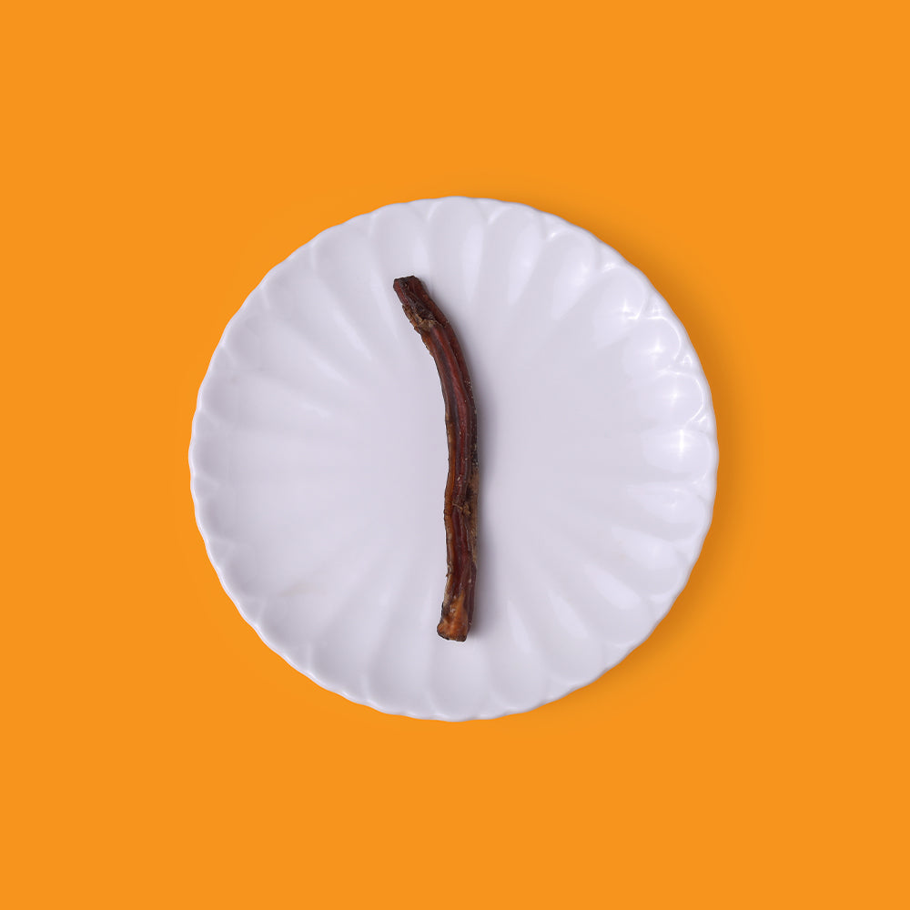 Single-ingredient buff pizzle chew for dogs. Medium size bully stick