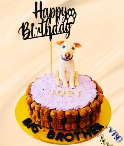 Dog Figurines on birthday cake celebration for dogs
